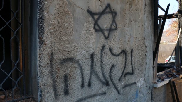 Hebrew graffiti - "Revenge" - sprayed on the wall of the Dawabshe family home.