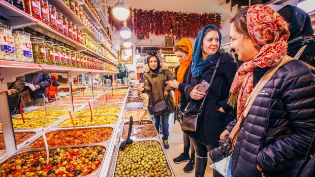 Shopping for pickles in the local market before a Persian cooking class, Tehran.