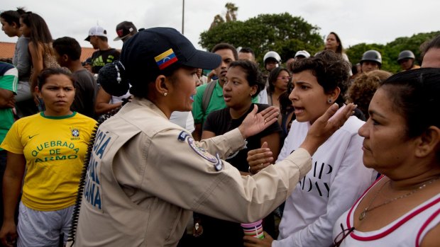 Tensions rise after customers waited in line for hours and their frustration turned into a street protest in Caracas.