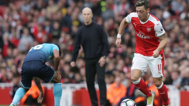 Top of the table: Mesut Ozil led Arsenal to another win.