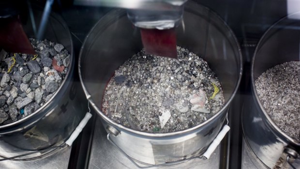 Diamonds are collected in buckets at the end stage of processing at the Diavik diamond mine facility. 