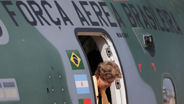 Brazilian President Dilma Rousseff tours a new model of military transport aircraft developed by the Brazilian aerospace manufacturer Embraer, in Brasilia on Tuesday.  