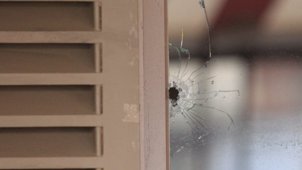 The bullet hole in the window of Billu's Indian Eatery in Wigram Street, Harris Park.