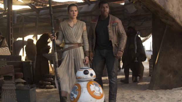 Star turn ... Rey (Daisy Ridley) and Finn (John Boyega) in 2015's The Force Awakens.