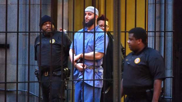 Retrial ordered ... Adnan Syed is escorted from a Baltimore court.