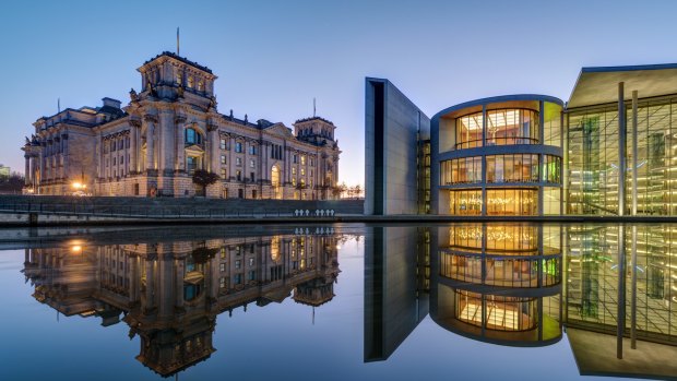 The famous Reichtsag and the Paul-Loebe-Haus at the river Spree in Berlin.