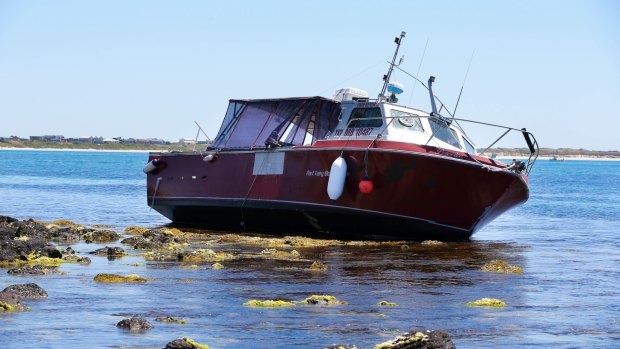 Police claim the alleged smugglers used this boat, which ran aground off Port Fairy.