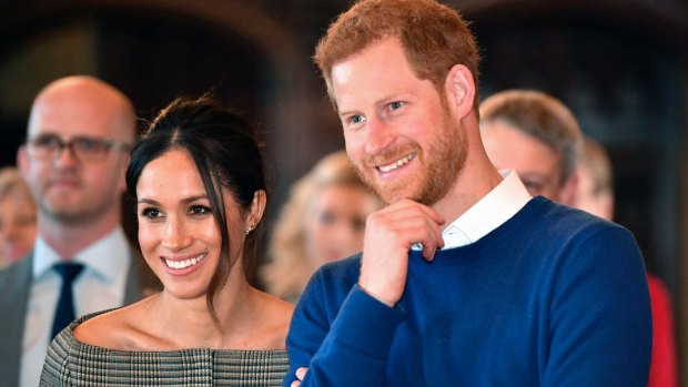 Prince Harry and Meghan Markle watch a performance at Cardiff Castle in Wales.