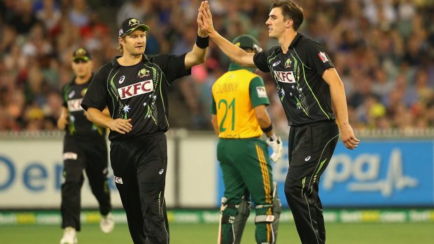 Talent: Pat Cummins (right) is congratulated by Shane Watson.