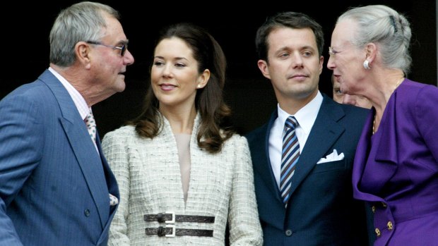 Denmark's Crown Prince Frederik and Princess Mary, centre, talk with Queen Margrethe and Prince Henrik on the balcony of Christian IX Palace in Copenhagen.