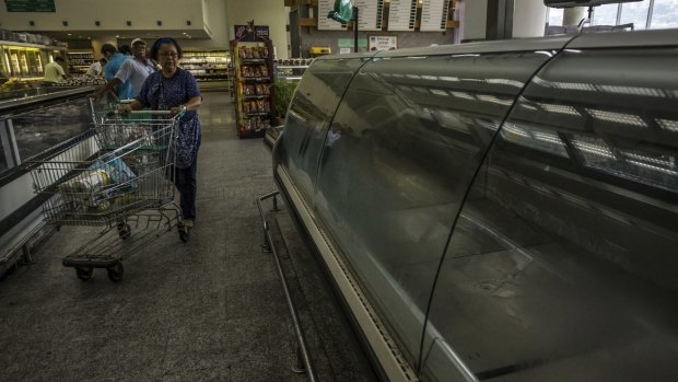 Empty meet freezers at a private grocery store in Caracas last month. Meat is among a long list of products in short supply in Venezuela. 