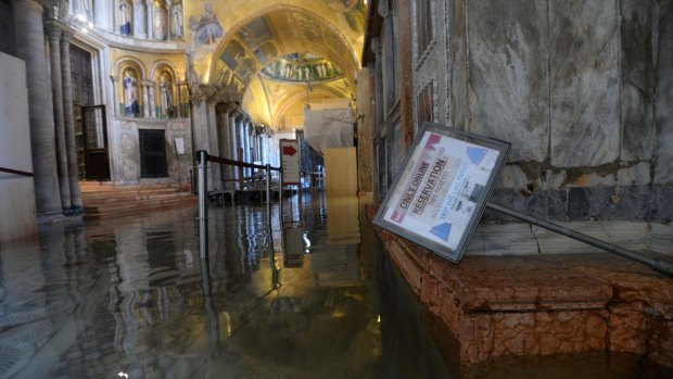 A view of the flooded interior of St. Mark's Basilica.