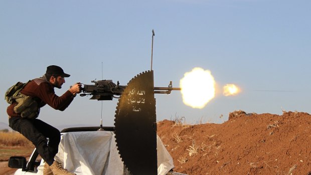 A Syrian fighter fires a heavy-machine gun during clashes with Islamic State militants in Aleppo last month. 
