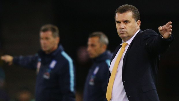 Socceroos head coach Ange Postecoglou gestures to players during the match between Australia and Greece.