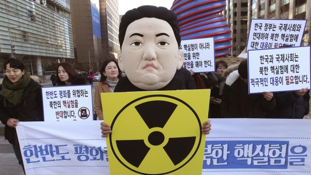 A South Korean university student wears a mask depicting North Korean dictator Kim Jong-un, after the North Korean regime claimed it had tested a hydrogen bomb.