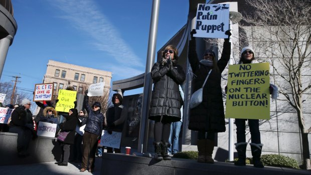 Protesters wave signs and shout as they demonstrate in freezing temperatures in New Jersey.