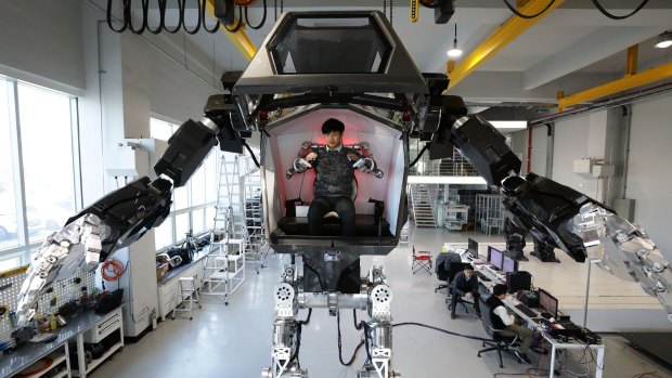 A human pilot can control the "Method-2" robot using arm gestures.