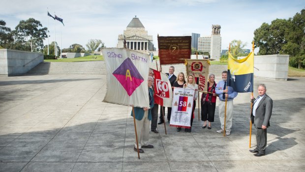 Descendants of WWI soldiers, including Mr Laird, with their banners at the Shrine. 
