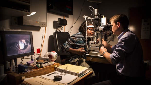 An Indigenous woman has her eyes examined at Alice Springs Base Hospital.