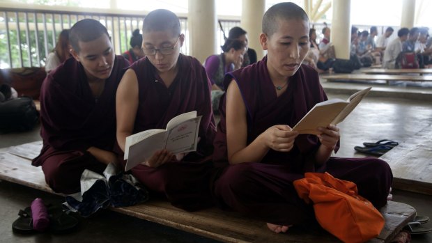 Exiled Tibetan Buddhist nuns in India pray to remember Tibetan lama Tenzin Delek Rinpoche.
