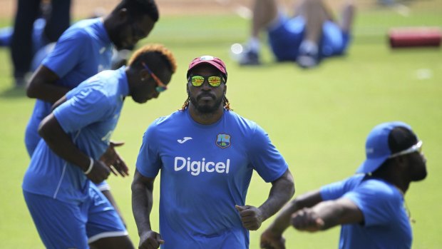 Chris Gayle (centre) warms up along with his teammates during a practice session in Mumbai on Wednesday.
