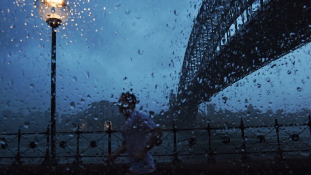 Some Sydneysiders braved the wet weather for a morning workout on the harbour.