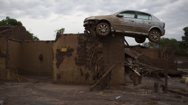 Pictures flashed around the world of towns submerged in red mud, of broken houses and cars plucked up by the force of the water and dropped on to rooftops.