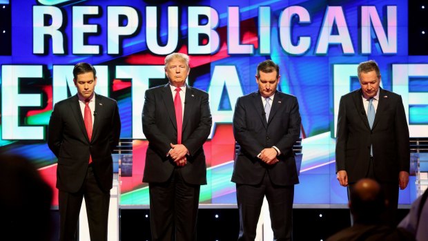 Republican presidential candidates, from left, Marco Rubio, Donald Trump, Ted Cruz, and John Kasich stand for a moment of silence for former first lady Nancy Reagan during the well-manned primary debate in Miami on Thursday.