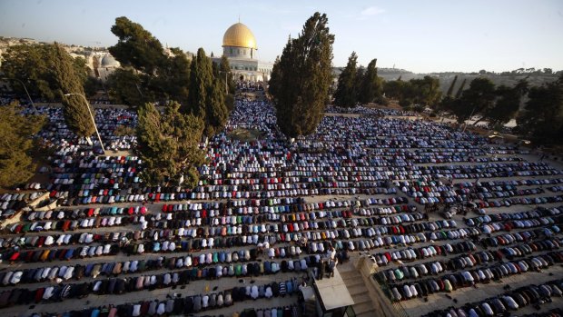Palestinians pray during the Muslim holiday of Eid al-Adha, near the Dome of the Rock  in the al-Aqsa Mosque compound in Jerusalem's occupied Old City.  