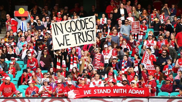 Wave of support: Fans display banners in support of Adam Goodes during Sydney's clash with the Adelaide Crows at the Sydney Cricket Ground.