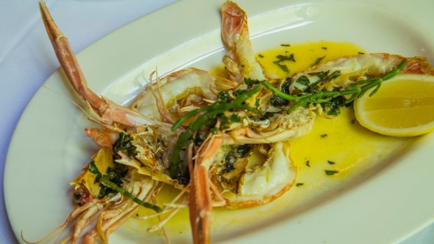A signature dish of grilled WA scampi with taragon and vanilla butter, topped with samphire.