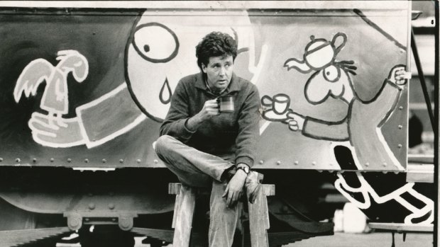 Michael Leunig takes a break while painting his art tram in the Preston depot in 1986.