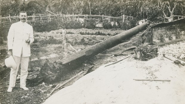 TENNIS COURT UNDAMAGED: The wireless operator who sent the SOS call that brought HMAS Sydney to the area, standing next to the wireless mast destroyed by the German raiding party from the Emden. 