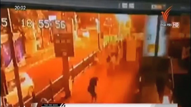 This image taken from security footage provided by Thai PBS shows the moment of an explosion in central Bangkok. It shows the bottom of the overheard walk-way used by Jimmy Barnes and his family.