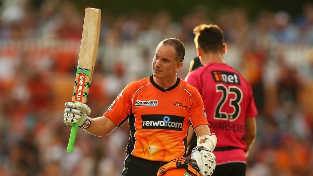 Green and gold, finally: Michael Klinger celebrates a half-century for the Scorchers in the BBL.