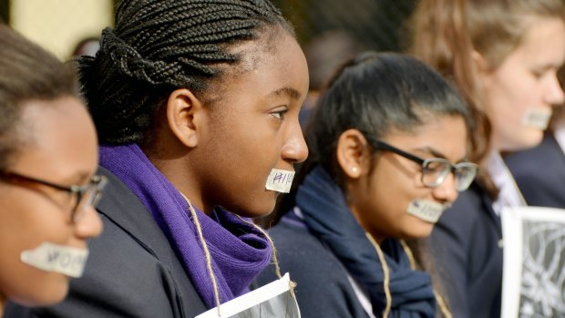 Students taped their mouths to protest the fact that asylum seekers don't have a voice.