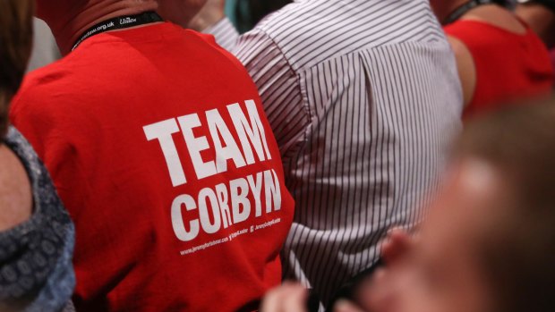 A member of the audience wears a Team Corbyn T-shirt during Jeremy Corbyn's speech at the party's annual conference in Brighton. 