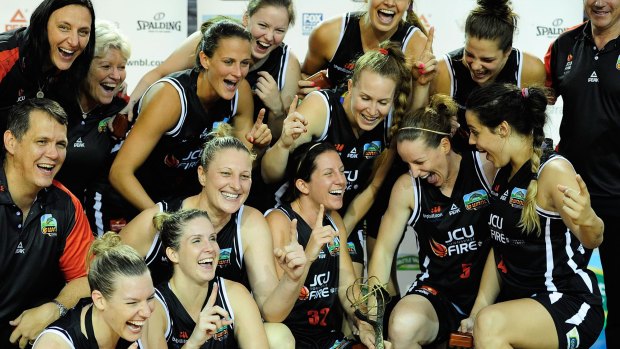 Ecstasy: Townsville Fire celebrate their WNBL title.