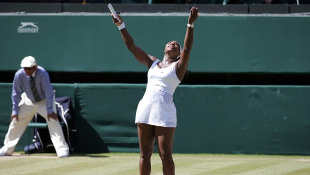 Triumphant again: Serena Williams throws her hands up in joy after winning the women's singles title.