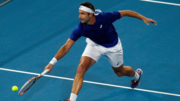 Lunge volley: Marinko Matosevic plays a backhand against Benoit Paire of France.