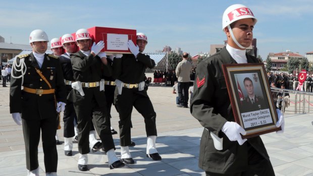 Turkish soldiers carry the coffin of Lieutenant Murat Taylan Oncel, 33, killed in an October mortar attack by Kurdish militants in the Diyarbakir region.
