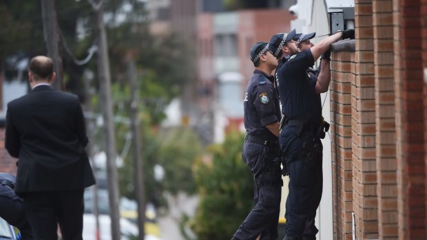 Police search Larkhall Avenue in Earlwood after Mr Barbaro was shot dead.