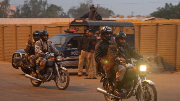 Pakistani paramilitary soldiers patrol on motorcycles outside the central jail in Karachi where authorities are said to have executed a prisoner.