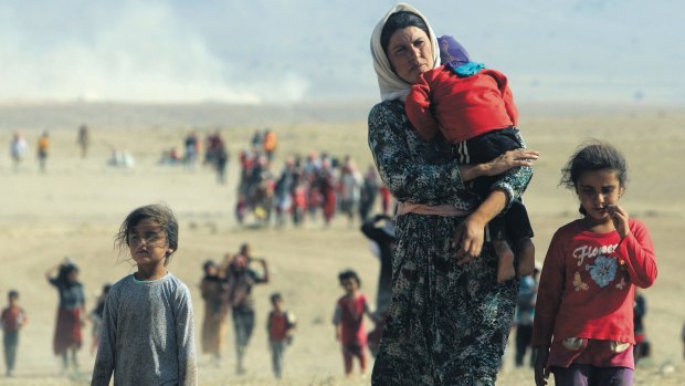 Displaced people from the minority Yazidi sect, fleeing Islamic State militants.