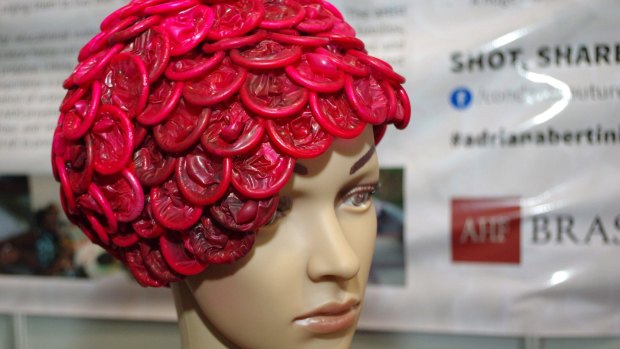 A mannequin wears headgear made of red condoms at the 2016 International AIDS Conference in Durban, South Africa.