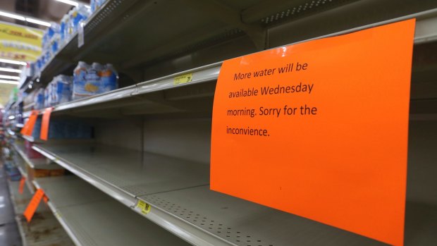 A shelf normally containing packaged water is empty at a Piggly Wiggly store in Panama, Florida, on Tuesday.