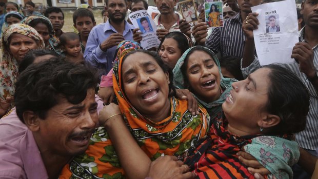 Relatives of Mohammed Abdullah, garment worker in Rana Plaza, cry as they as they arrive to collect his body near Dhaka, Bangladesh.