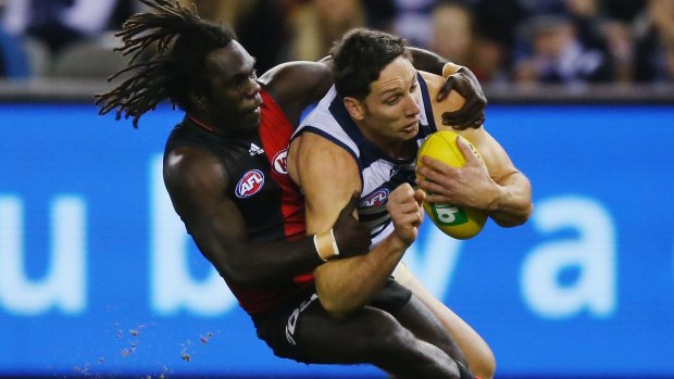 Tip top: Bomber Anthony McDonald-Tipungwuti tackles Cats defender Harry Taylor.