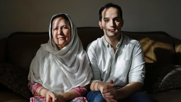 Shamim Syed, left, whose son Adnan was convicted for the 1999 murder of his ex-girlfriend, poses for a photograph alongside her son Yusef in her home  in Baltimore.