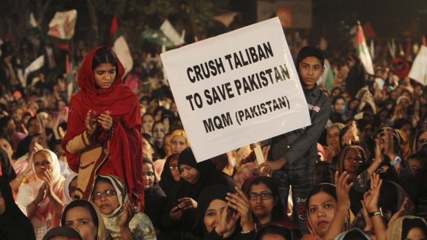 Supporters of Pakistan's MQM political party call for harsh measures against the Taliban at a rally in Karachi on Friday.
